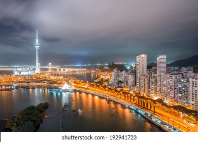 Macau, China. Aerial View Of City Buildings And Tower At Night.