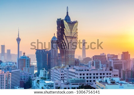Macau, city skyline at sunset.