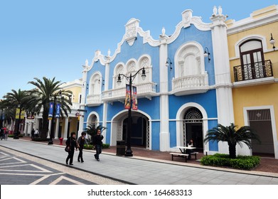 MACAU - FEB 26 2009 :Tourists Walks Under Colonial Portuguese Buildings In Macao Fisherman's Wharf.It's The First Theme Park In Macau Officially Opened On December 31, 2006.