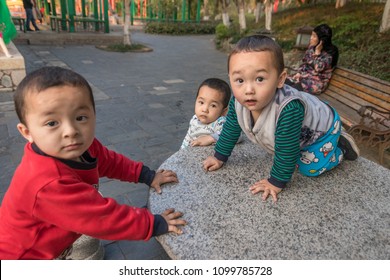 Macau,china - May 12,2018 : Three Triplets Are Playing Happily.