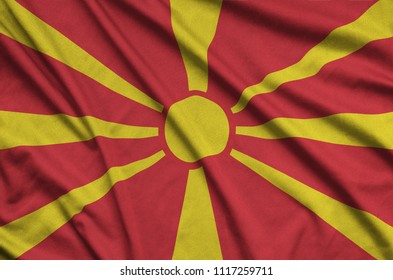 Macedonia flag  is depicted on a sports cloth fabric with many folds. Sport team banner