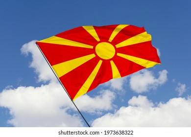 Macedonia flag isolated on sky background with clipping path. close up waving flag of Macedonia. flag symbols of Macedonia.