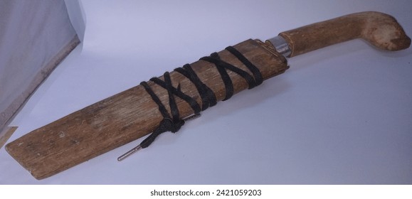 A machete is a sharp tool or weapon typical of Indonesia, especially West Java, usually used for cutting or as a work tool at home, in the garden, in the fields, etc. The machete is made of iron which