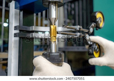 A machine for checking cutters and cutting tools for runout in the centers using indicators.