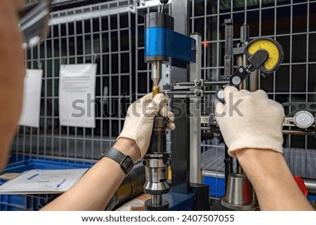 A machine for checking cutters and cutting tools for runout in the centers using indicators.