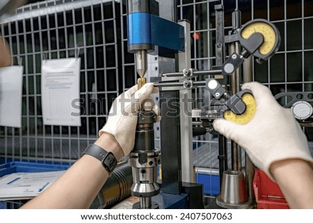 A machine for checking cutters and cutting tools for runout in the centers using indicators.