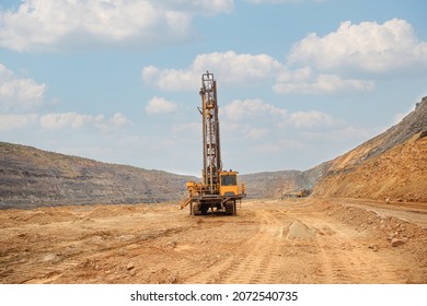 Machine for drilling wells in the quarry. Drilling of boreholes for laying an explosion in a quarry. Technologies of open pit mining of minerals.