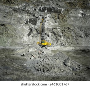 Machine for drilling wells in the quarry. Drilling of boreholes for laying an explosion in a quarry. Technologies of open pit mining of minerals. - Powered by Shutterstock