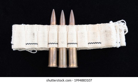 Machine Gun Ammo On A Black Background, Unusual Bullet Belt