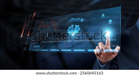 Machine Learning: Businessman analyzes data strategy with graph on digital screen. Predictive analytics, data modeling, algorithm development, automation, pattern recognition, decision-making.