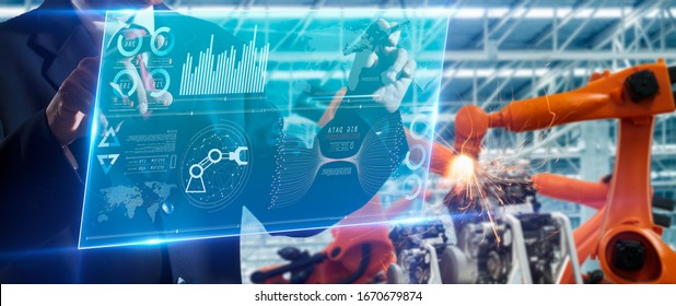 Machine Learning,AI,Artificial Intelligence,Big Data,deep Learning,Industry 4th And Iot Concept.Engineer Hand Using Tablet Heavy Automation Robot Arm Machine In Smart Factory Industrial With Table.