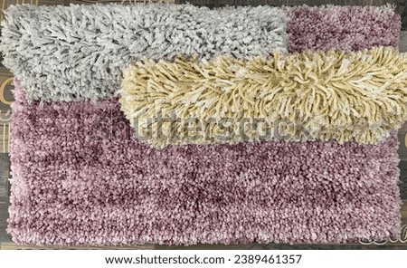 Machine made polyester shag bath rug.
