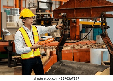 Machine operator skillfully operate steel forming machinery, making cylinder rolled steel for heavy construction engineering material in metalwork manufacturing factory. Exemplifying - Shutterstock ID 2396367259
