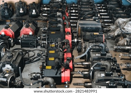 Machine part industrial engine assembly repair workshop metal equipment mechanical parts arranged workshop for engine repair, showing industrial metal equipment, assembly component, pipe, gear