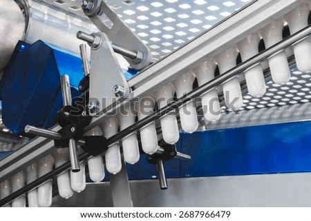 Machine for producing plastic beverage bottles using extrusion method from plastic preformed PET capsules