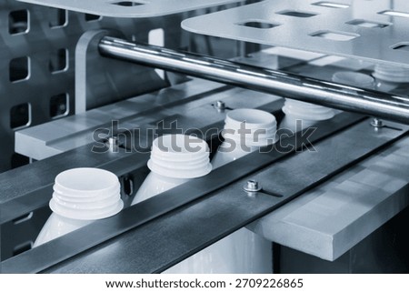 Machine for producing plastic beverage bottles using extrusion method from plastic preformed PET capsules