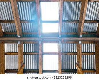 a machine shop workshop factory roof rafters ceiling light corrugated beams shed metal tin wood beams