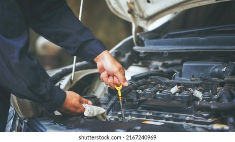 Machine,Auto Mechanic Working In Repair Service Garage. Repair Service Center Concept, Expert Repair Technicians In Modern Service Centers.