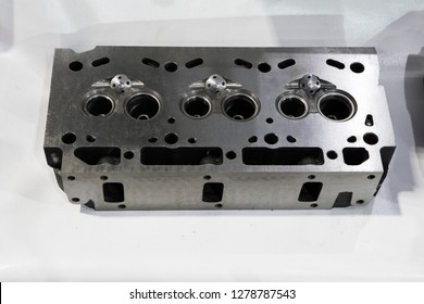 As machined head cylinder from iron casting ; close up
