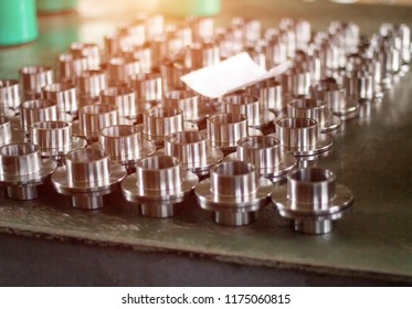 Machined metal hub clips for pressing the bearing, close-up, production, assemblage - Shutterstock ID 1175060815