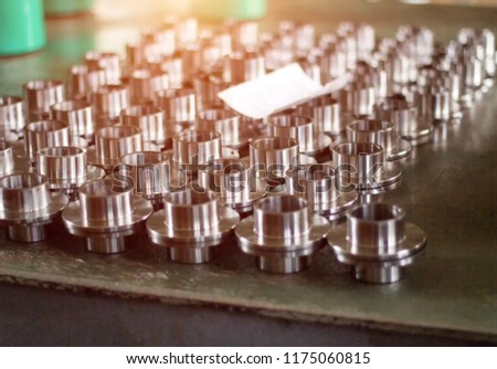 Machined metal hub clips for pressing the bearing, close-up, production, assemblage