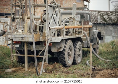 Machinery Drilling Water Well For House. Water Well Drilling. Ground Water Hole Drilling Machine On The Old Truck.