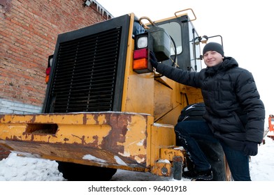 Machinery driver in winter. Machinery driver