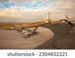 Machinery stacking copper sulfide deposits at a copper mine in Chile