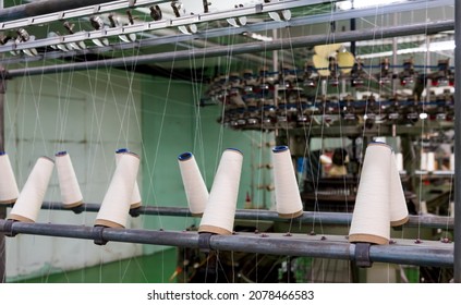 Machines For Weaving Yarns Used In Industrial Factories. Modern Technology In Spinning Yarn. Textile Industry - Yarn Spools On Spinning Machine In Textile Factory.