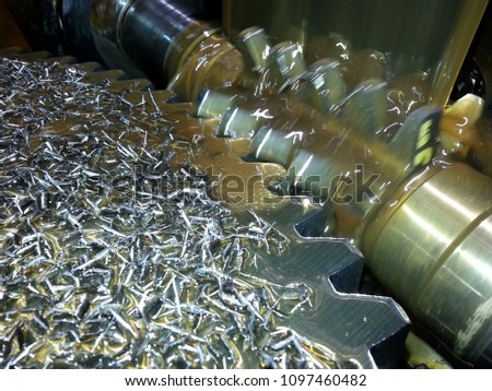 Machining process of involute gear cutting-closeup of gear cutting tool hob and gear teeth