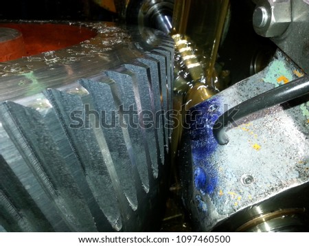 Machining process of involute gear cutting-closeup of gear cutting tool hob and gear teeth