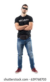 Macho Bouncer Or Undercover Cop In Plain Clothes Looking At Camera With Crossed Arms. Full Body Length Portrait Isolated On White Studio Background. 