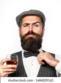 Macho Drinking. Stylish Rich Man Holding A Glass Of Old Whisky. Bearded Gentleman Drink Cognac. Sipping Finest Whiskey. Portrait Of Man With Thick Beard.