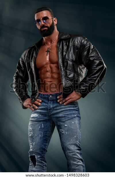 Macho Men in Leather Jacket on Naked Torso Exposing\
His Muscular Body