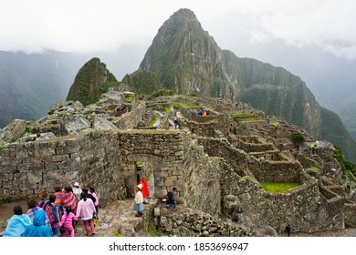 Machu Picchu, Cloudy Day, Group Of Indians Walking, Peru, South America, 04/11/2012