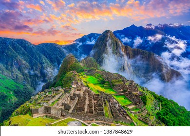 Machu Picchu, Cusco,Peru: Overview of the lost inca city Machu Picchu, agriculture terraces and Wayna Picchu, peak in the background,before sunrise - Shutterstock ID 1387848629