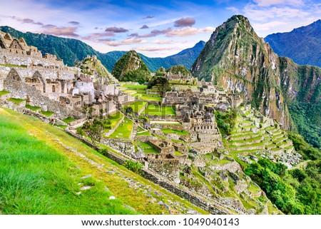 Machu Picchu in Peru - Ruins of Inca Empire city and Huaynapicchu Mountain in Sacred Valley, Cusco, South America.