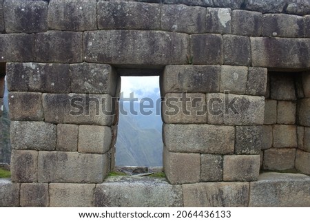 Machupicchu  Cusco  Peru Historical, touristic place of the ancient civilization of the Inca Empire. Runes of the ancient city on the mountain of Machupichu and Huayna Picchu. House with window 