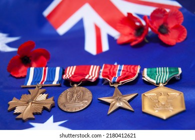 Mackay, Queensland, Australia - December 2020; Service Medals Awarded During The Vietnam War To A Member Of The Naval Fleet Air Arm On An Australian Flag With Red Poppies.