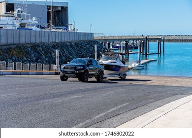 Mackay, Queensland, Australia - June 2020: Fisherman Launching His Boat At Recreational Public Boat Ramp At The Marina