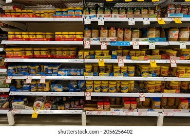 Mackay, Queensland, Australia - October 2021: Bottles of spreads for sale on supermarket shelves including peanut butter and vegemite