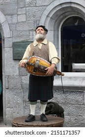 Macnas Street Performance, An Old Man In Irish Folk Costume ( Irish Kilt )plays The Banjo On The Street, 9th May 2015, Galway, Ireland