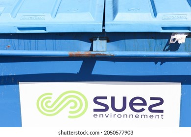 Macon, France - March 15, 2020: Suez environnement logo on a dumpster. Suez is a French-based utility company which operates largely in the water treatment and waste management sectors
