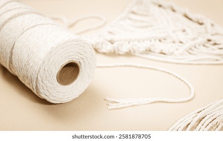 macrame and cotton threads on light background, suitable for ban