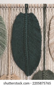 macrame forest green feather cotton string on wall feather closeup - Shutterstock ID 2205875765