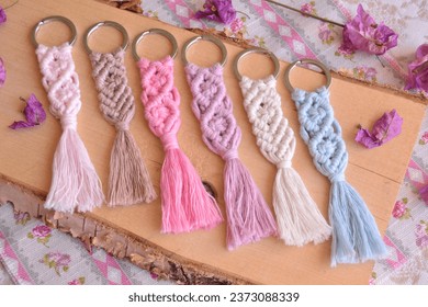 Macrame key chains wood background diy handmade hobby small gifts, wedding guest favors colorful rustic vintage boho style souvenirs, beautiful artisan presents, small home business, sell online