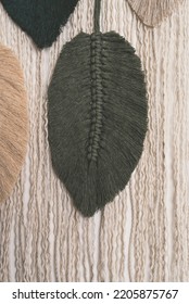 macrame olive green feather cotton string on wall feather closeup - Shutterstock ID 2205875767