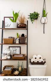 Macrame Plant Hangers Displayed In A Bathroom Corner, Hanging From The Ceiling With Various Decor On A Leaning Shelf.