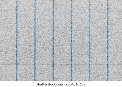 Macro 1:1 close-up of grey notepad paper with a finer blue grid pattern, revealing paper fibers, perfect for office, stationery, and detailed graph paper backgrounds.