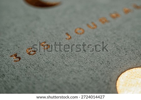 Macro of 365 Journal Embossed Text